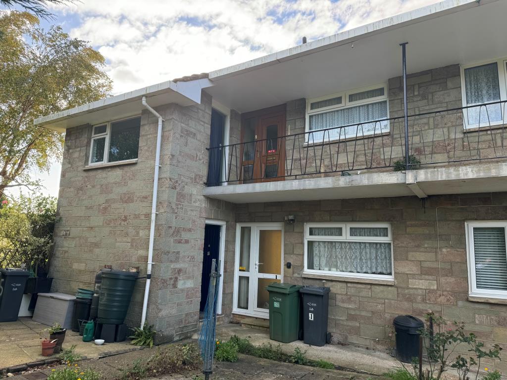 Lot: 62 - GROUND FLOOR FLAT WITH GARAGE FOR INVESTMENT OR OCCUPATION - Rear view of building showing entrances to flats